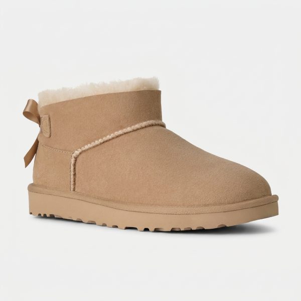 Śniegowce UGG Ultra Mini Bailey Bow Beżowy damski